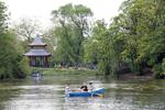 People rowing a boat in front of the Chinese Pagoda