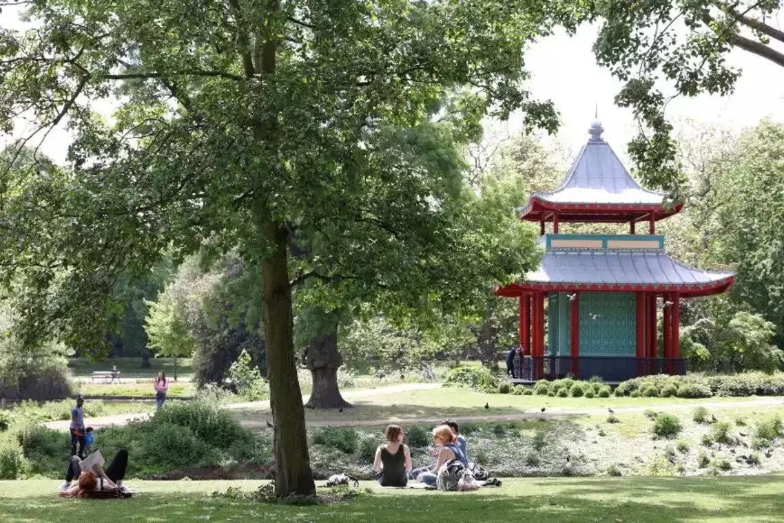 People sitting in front of the Chinese Pagoda