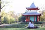 Person sitting in front of the Chinese Pagoda